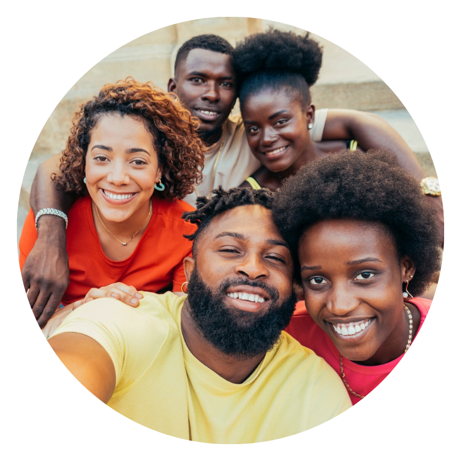 Group of people smiling together in a supportive setting, representing mental health, emotional well-being, therapy support, and positive human connection.